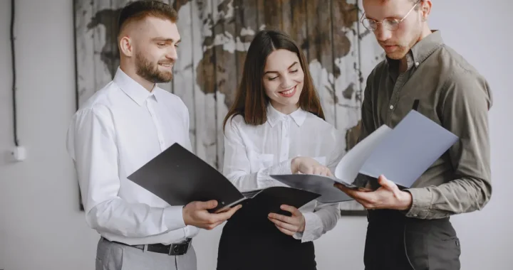 Three coworkers reviewing documents together