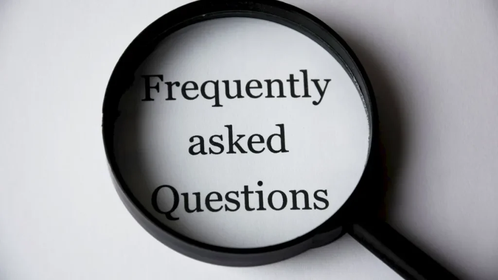 Magnifying glass over the words Frequently Asked Questions