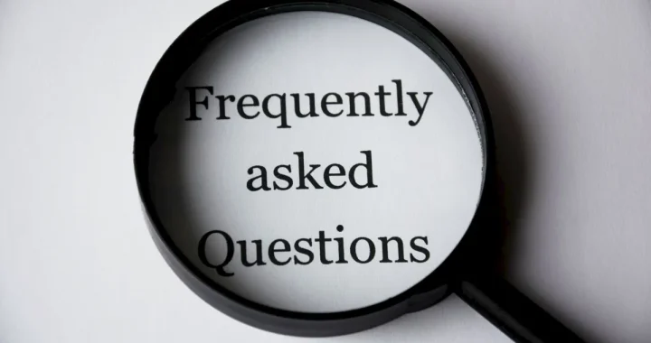 Magnifying glass over the words Frequently Asked Questions