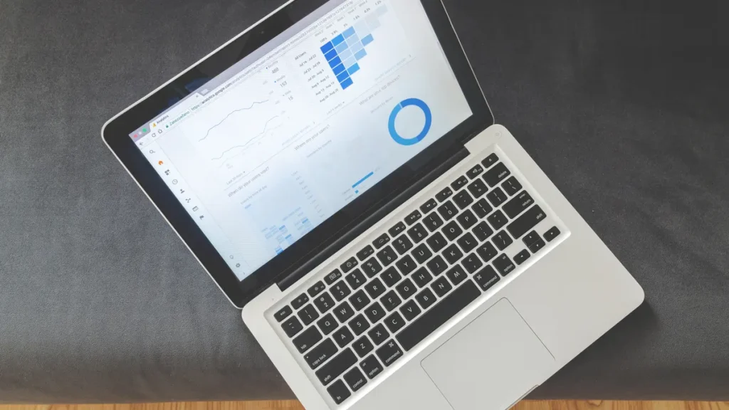 laptop showing analytics charts on screen