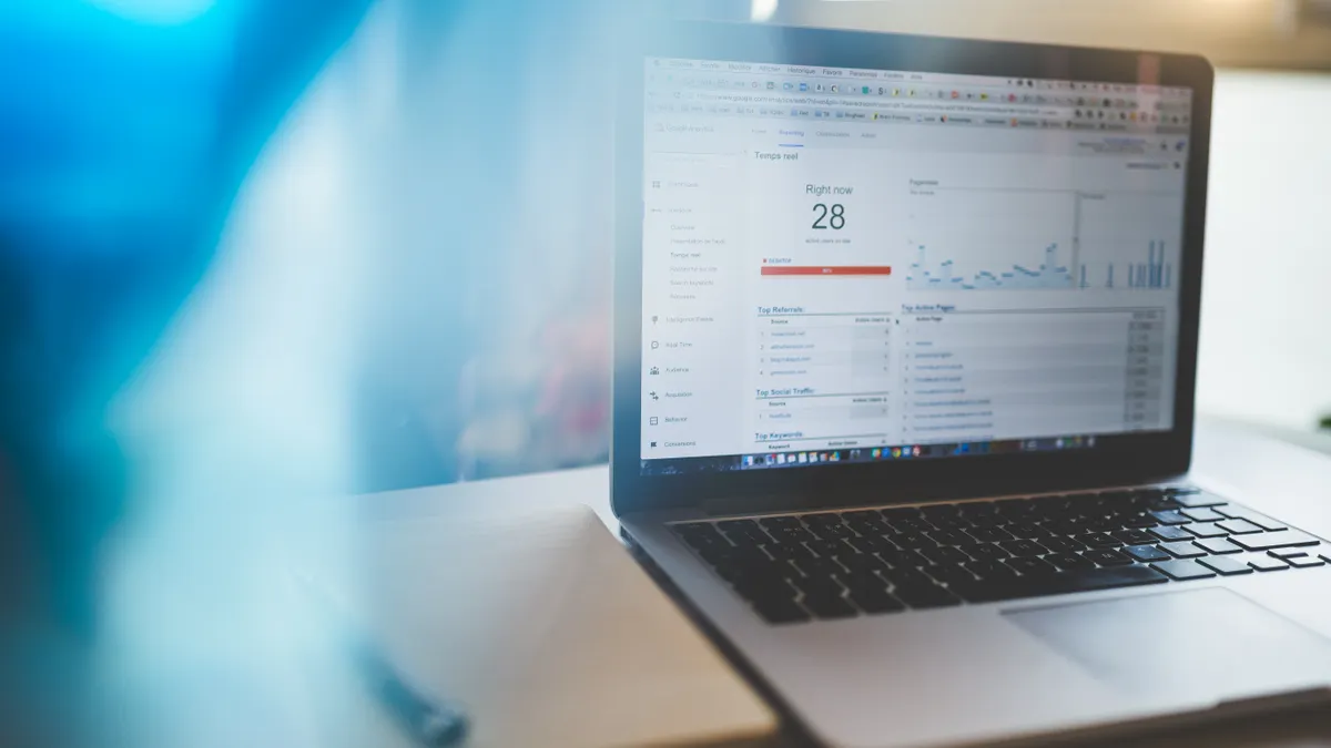 laptop displaying a data analytics dashboard